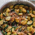 healthy Asian zucchini stir fry served over rice with text