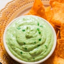 creamy avocado dip served with nachos