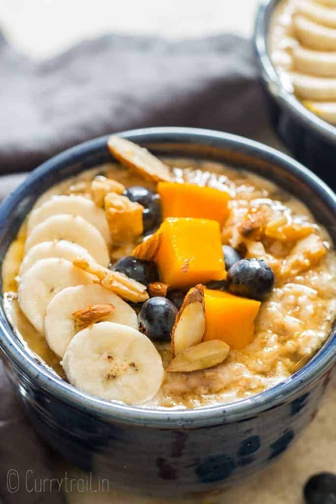 instant pot steel cut oats served with fruits and berries in ceramic bowls