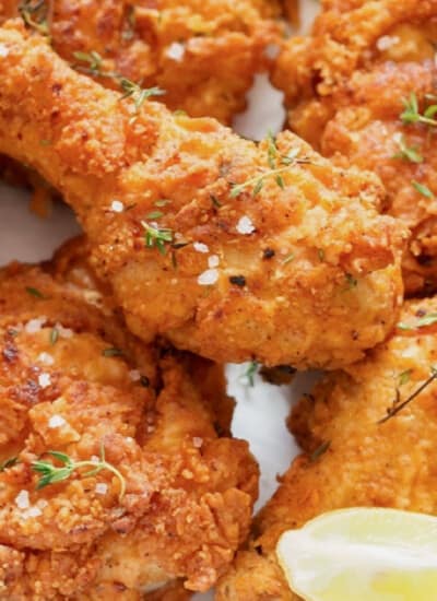 close up view of crispy fried chicken on a plate.