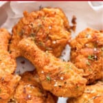 crispy Southern fried chicken on a plate with text.