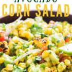 corn salad with avocados and cherry tomatoes in wooden bowl with text