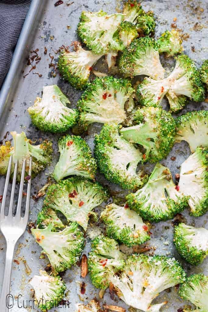 simple oven roasted broccoli on baking tray with fork