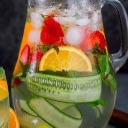Refreshing homemade infused water in pitcher