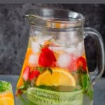 fruit-infused water in a pitcher and glass.