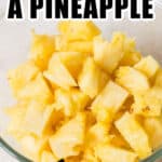 chunks of cut pineapple in glass bowl with text