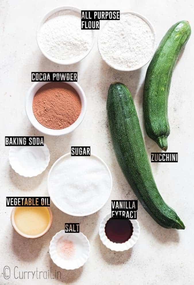 all ingredients for zucchini brownies placed on white board