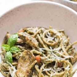 chicken pesto pasta served in ceramic bowl