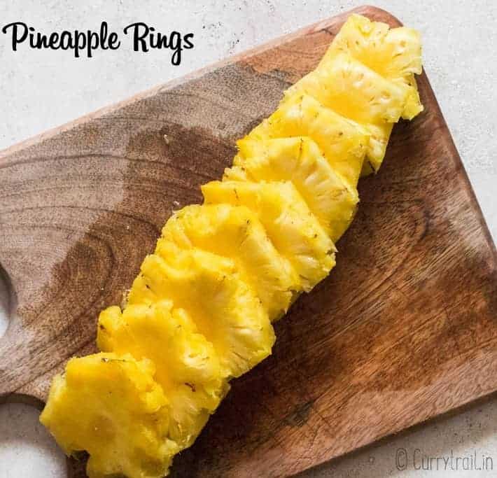 pineapple rings cut on wooden board