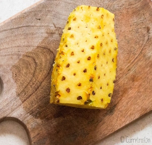 pineapple cutting on wooden board