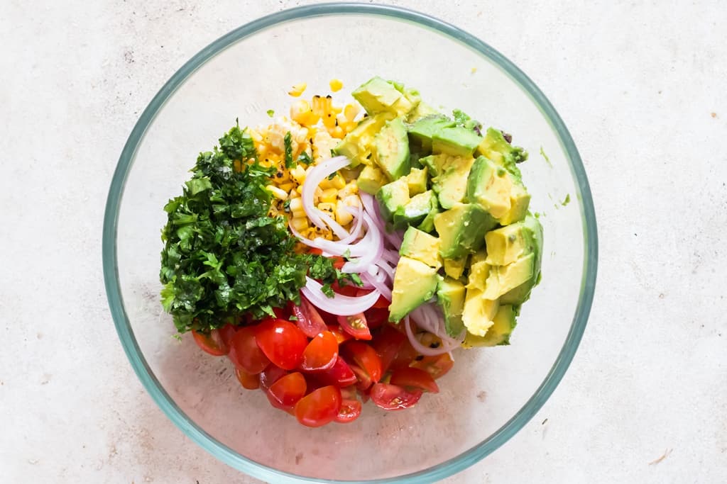 all ingredients for corn salad in a bowl.