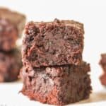 moist brownies made from zucchini stacked one on top of other.