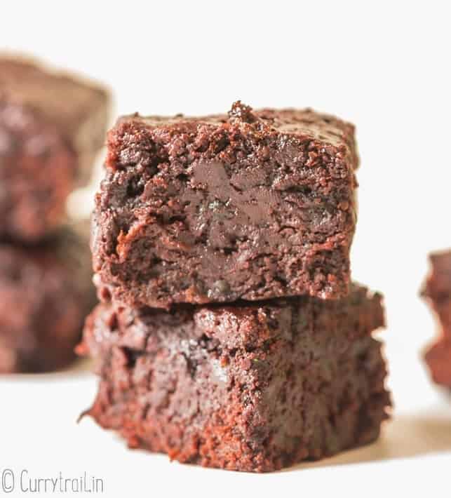 moist brownies made from zucchini stacked one on top of other