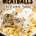 juicy meatballs in creamy white sauce in while bowl over pasta with text