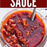 spicy schezwan sauce in glass jar with text