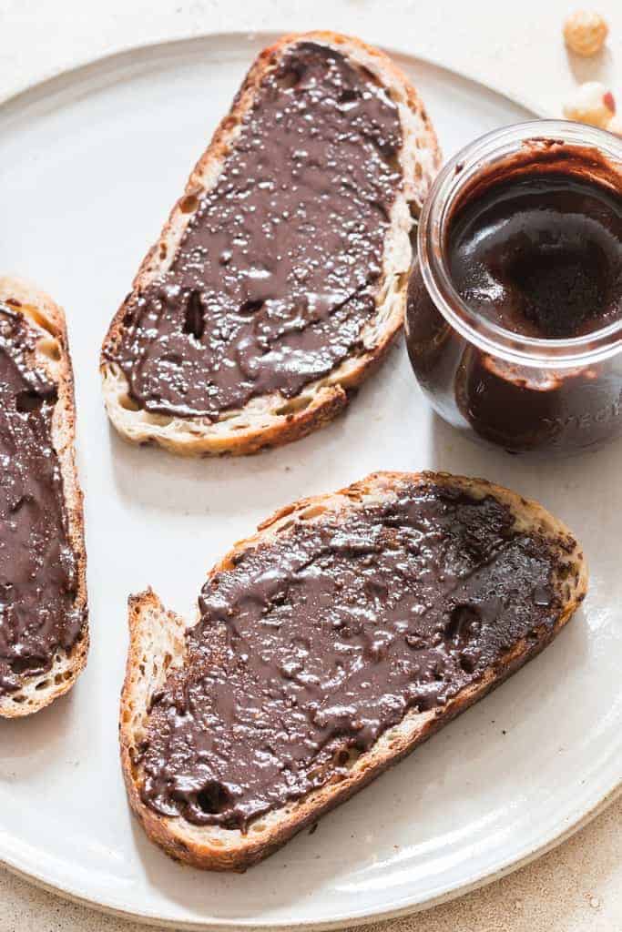 Nutella made at home spread on sourdough bread slice