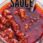 spicy schezwan sauce in glass jar with text