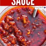 spicy schezwan sauce in glass jar with text