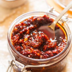 spicy schezwan sauce in a glass jar.