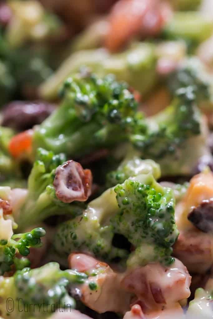 healthy broccoli salad in wooden bowl with napkin