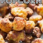 bite size cauliflower popcorn served with chili sauce on white plate with text