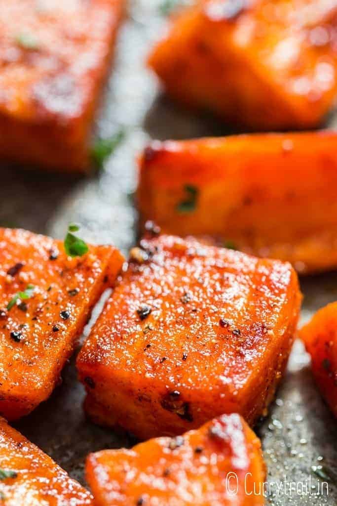 roasted sweet potatoes on baking tray with text