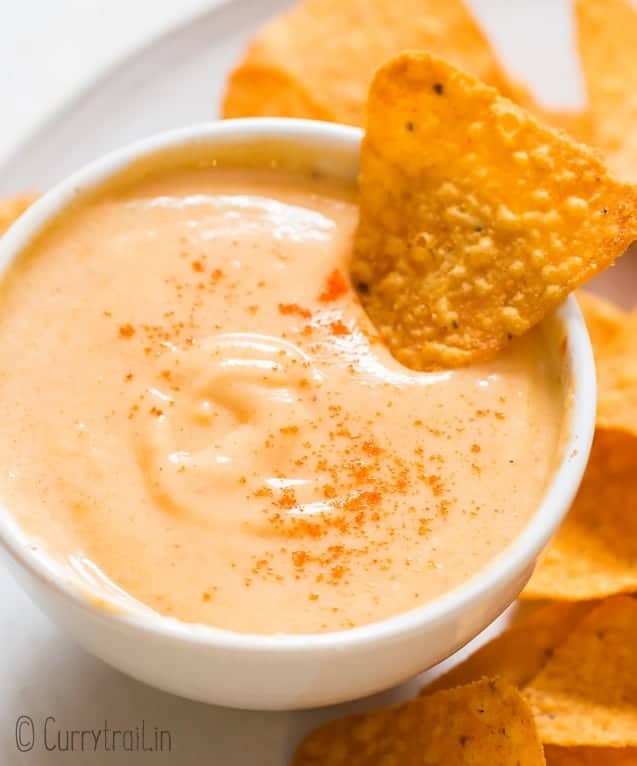 spicy nacho cheese sauce served in small bowl