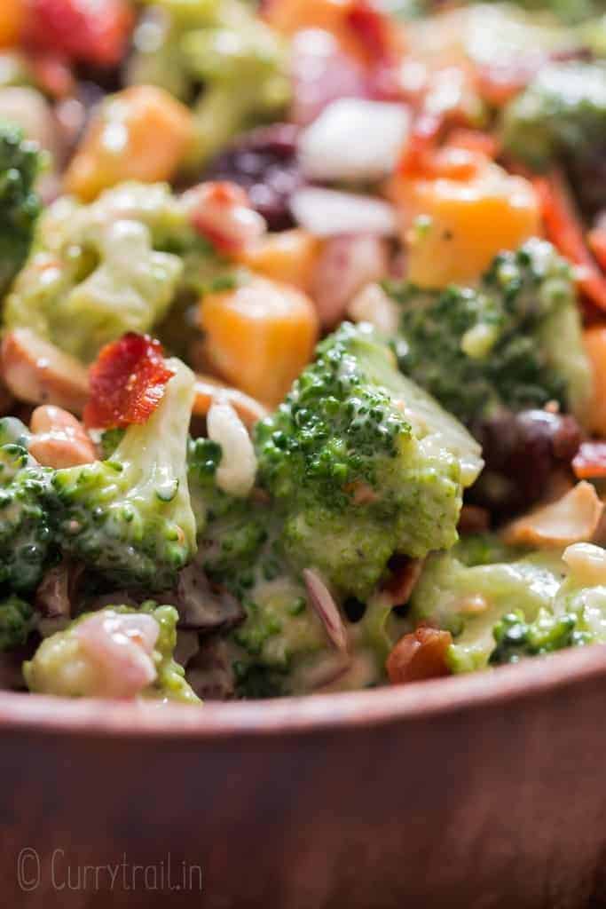 healthy broccoli salad in wooden bowl with napkin