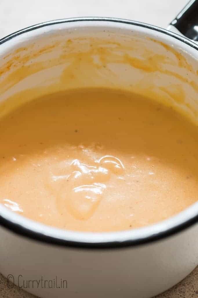 homemade cheese sauce made in white sauce pan
