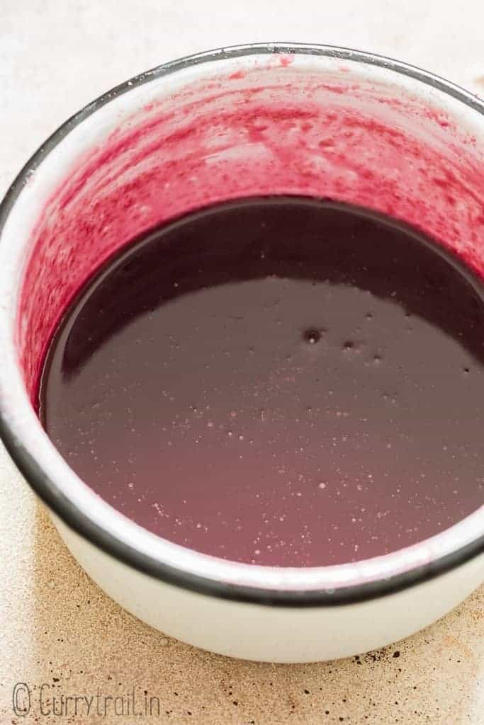 pomegranate molasses cooked in white sauce pan