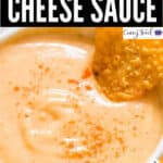 spicy nacho cheese sauce in a bowl with nachos with text overlay