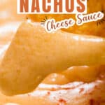 nacho dipped in spicy cheese sauce with text