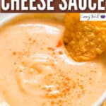 spicy nacho cheese sauce in a bowl with nachos with text overlay
