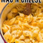 creamy butternut mac and cheese in pot with wooden spatula with text