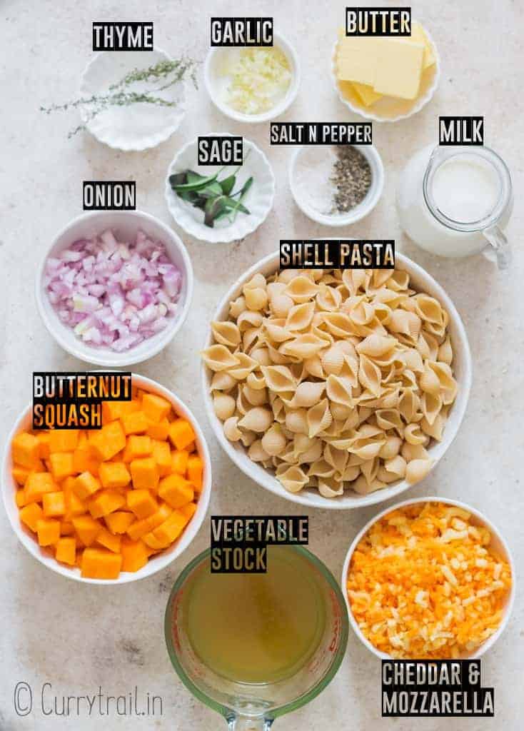 all ingredients for butternut squash mac and cheese on white board