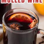 homemade mulled wine served in heat proof mugs with spices on side with text