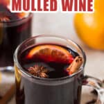 homemade mulled wine served in heat proof mugs with spices on side with text