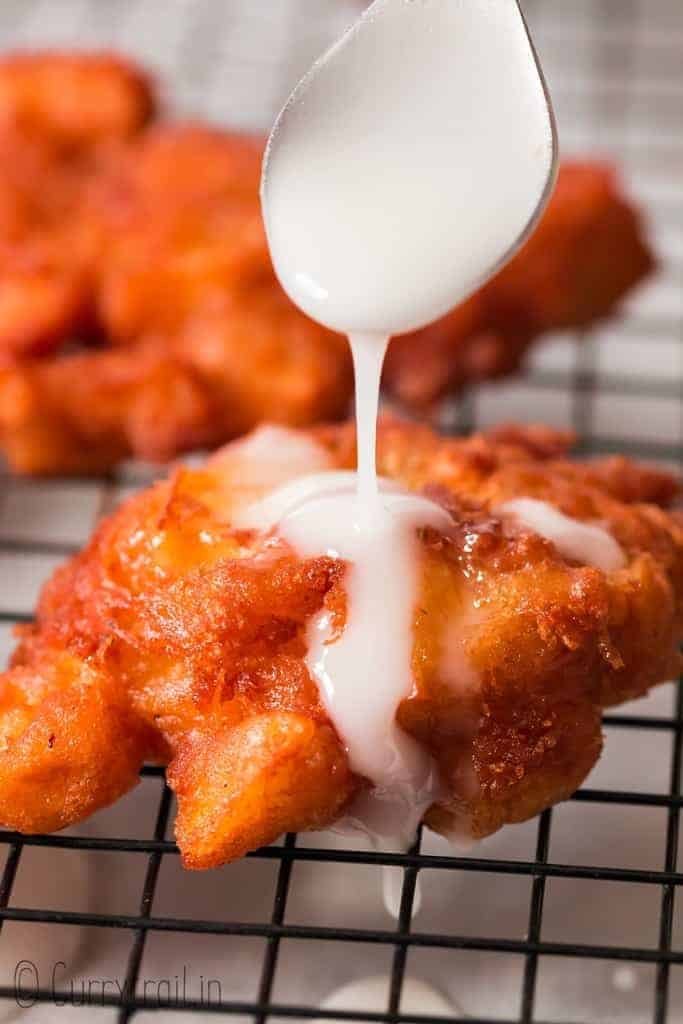 glazed fritters with apples on wire rack