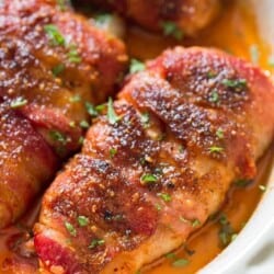 chicken breast wrapped with fatty bacon and baked until caramelized to perfection in baking dish.
