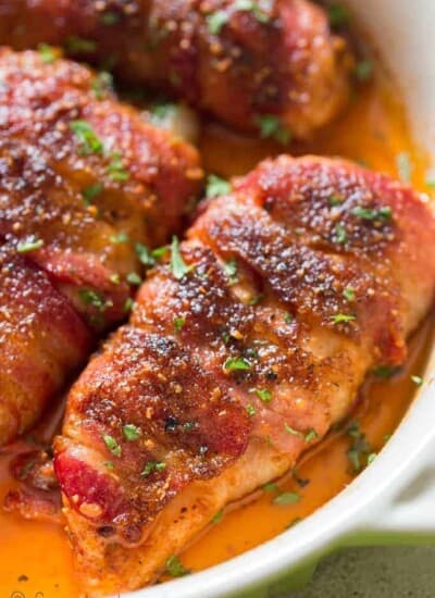 chicken breast wrapped with fatty bacon and baked until caramelized to perfection in baking dish