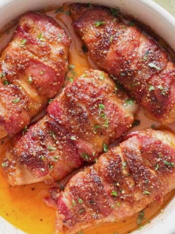 chicken breast wrapped with fatty bacon and baked until caramelized to perfection in baking dish.