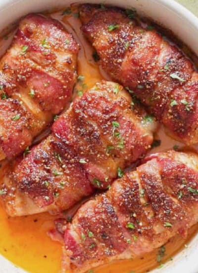 chicken breast wrapped with fatty bacon and baked until caramelized to perfection in baking dish.