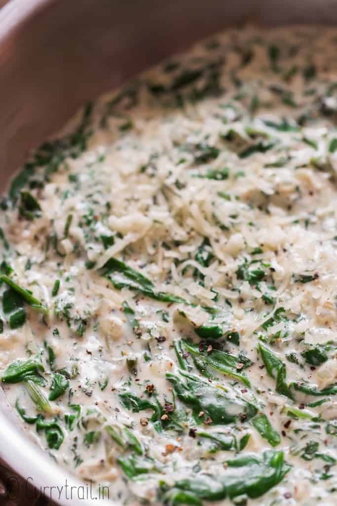 close up of creamed spinach recipe in a skillet