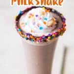 Nutella milkshake in tall glass with whipped cream and sprinkles with text