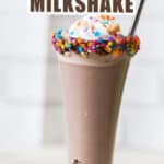 Nutella milkshake in tall glass with whipped cream and sprinkles with text