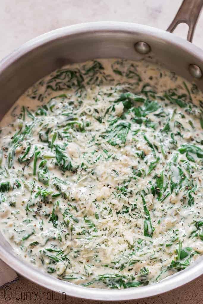spinach cooked in cream sauce in skillet
