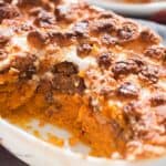 easy sweet potato casserole dish with mini marshmallow and pecan crumb topping in casserole dish with text overlay