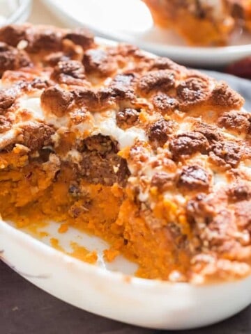 easy sweet potato casserole dish with mini marshmallow and pecan crumb topping in casserole dish with text overlay
