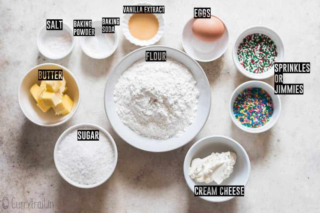 all ingredients for sprinkle cookies on white board