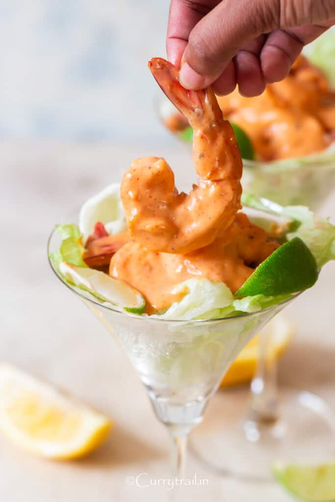juicy jumbo size prawn in pink Marie sauce served in a cocktail glass.